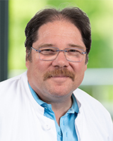 Dr. André Schneider